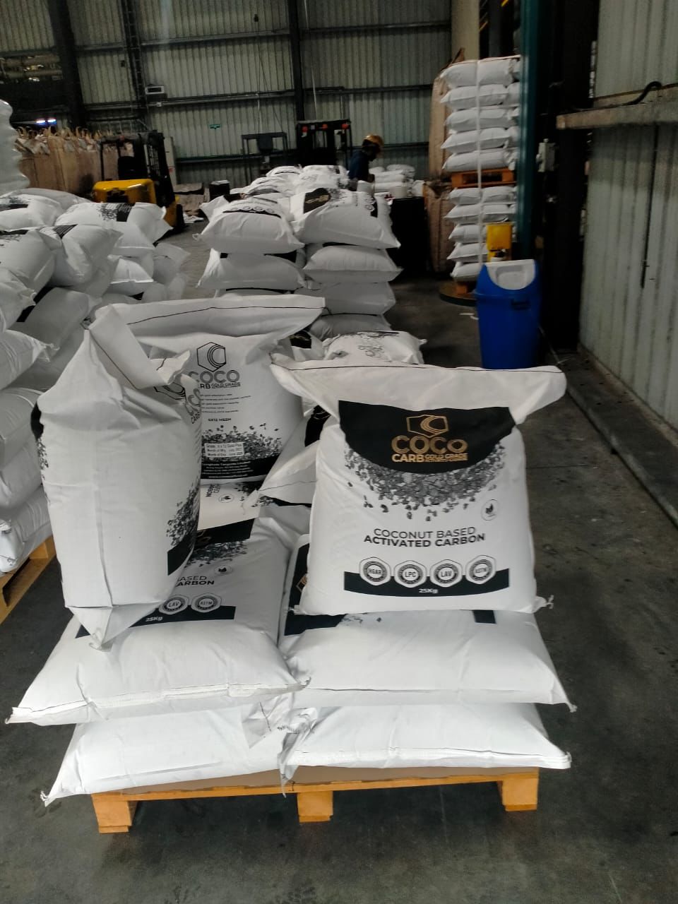 Warehouse with stacked activated carbon bags